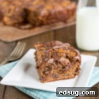 Peanut Butter Banana Snack Cake - This banana cake recipe is so tender and delicious with the peanut butter, chocolate chips, and topped with Nutella!