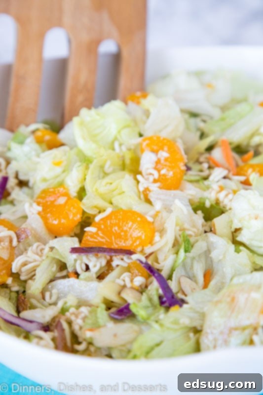 Far East Crunch Salad 2 A bowl of food on a plate, with Salad and Ramen