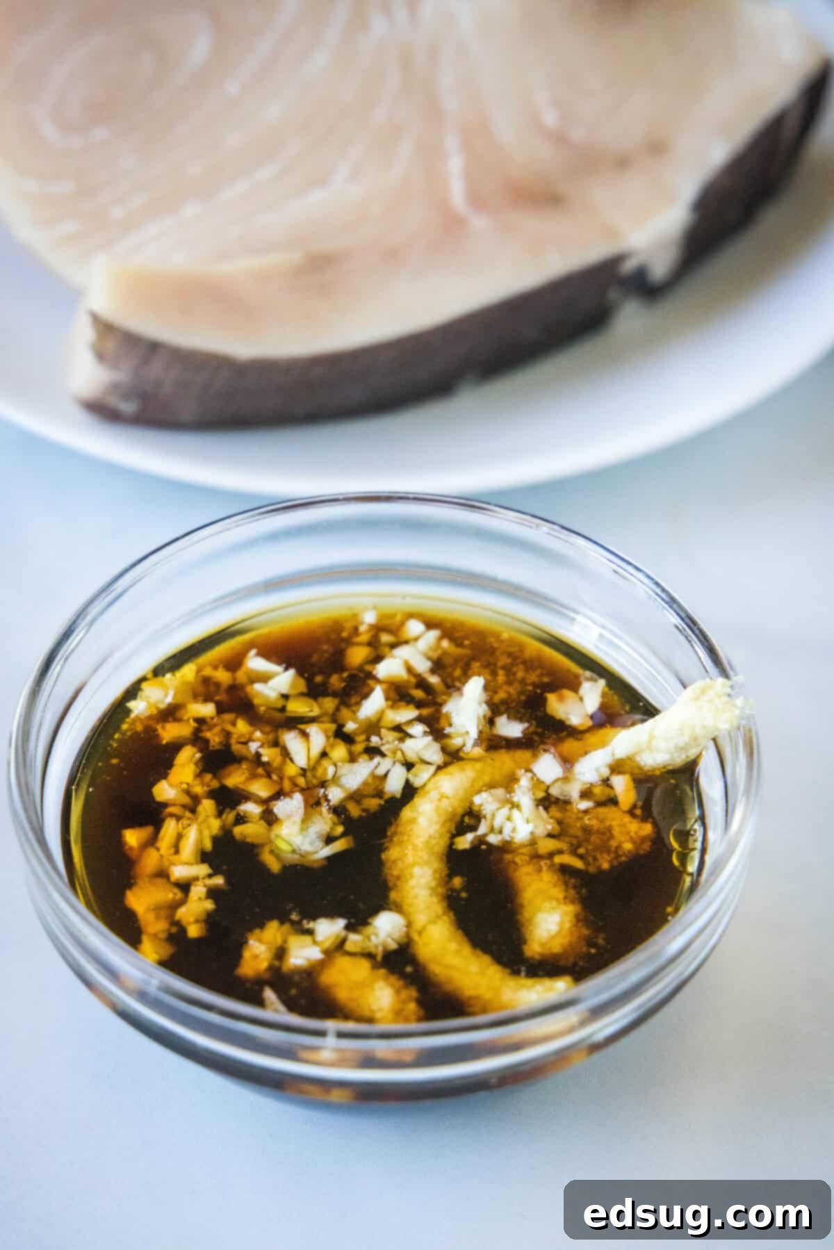 Bowl filled with swordfish marinade ingredients