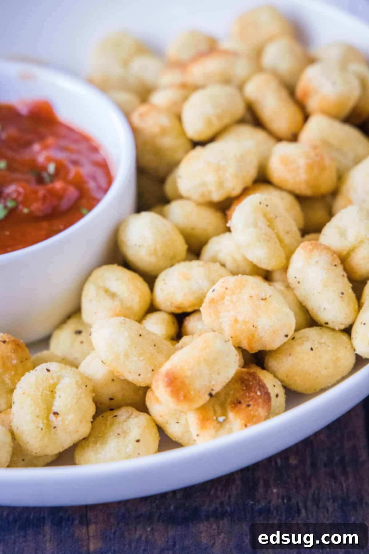 Air Fryer Gnocchi 6 crispy air fryer gnocchi on a serving plate