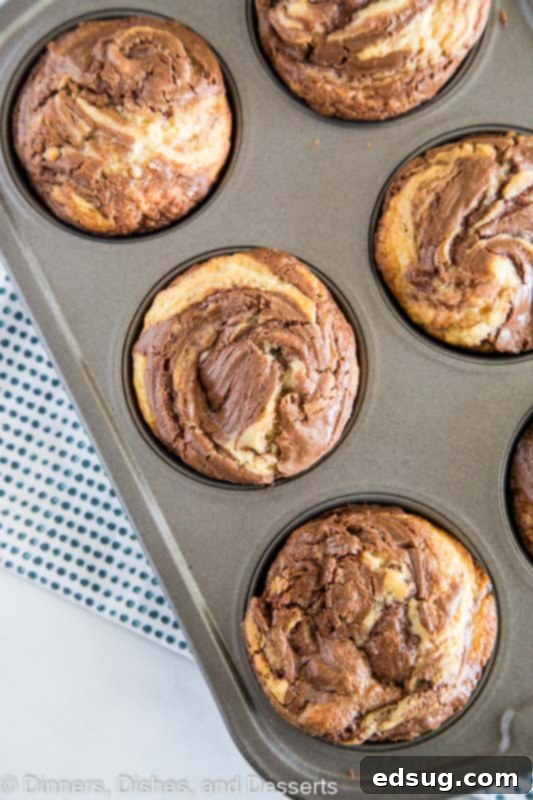 Decadent Nutella Muffins 2 Nutella muffins in muffin tin