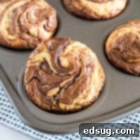 Decadent Nutella Muffins 6 Nutella Muffins - Soft and tender homemade muffins with a delicious swirl of Nutella.