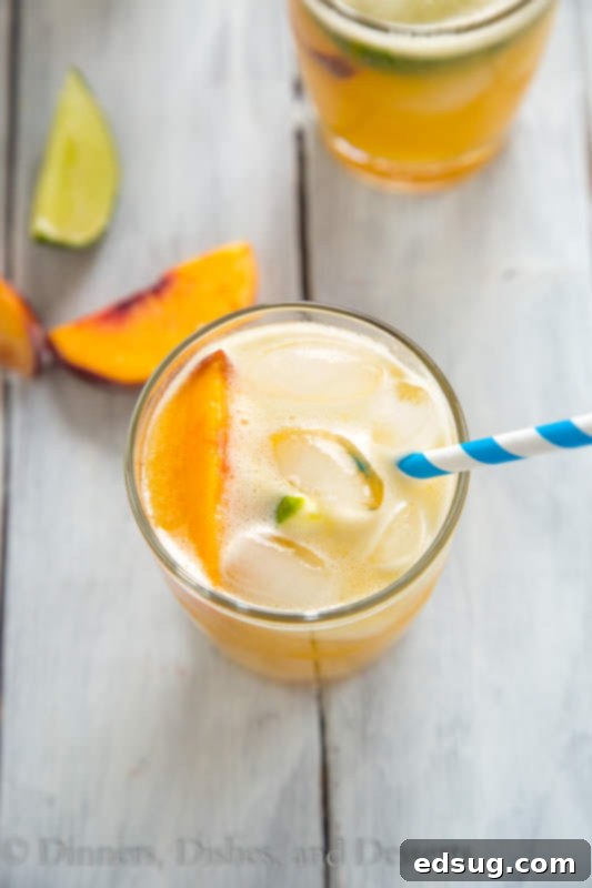 Southern Peach Bourbon Quencher 3 Ingredients for Bourbon Peach Limeade including fresh peaches, limes, and bourbon bottle.