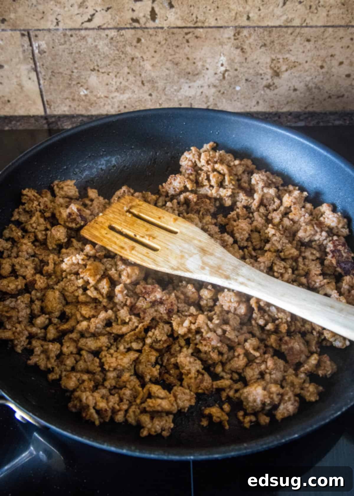 Sausage and Rice Bake 5 Cooked spicy Italian sausage in a skillet, broken into pieces.