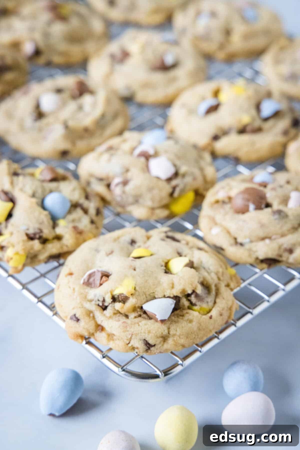 Ultimate Cadbury Mini Egg Cookies 4 cadbury mini egg cookies cooling on a wire rack after baking