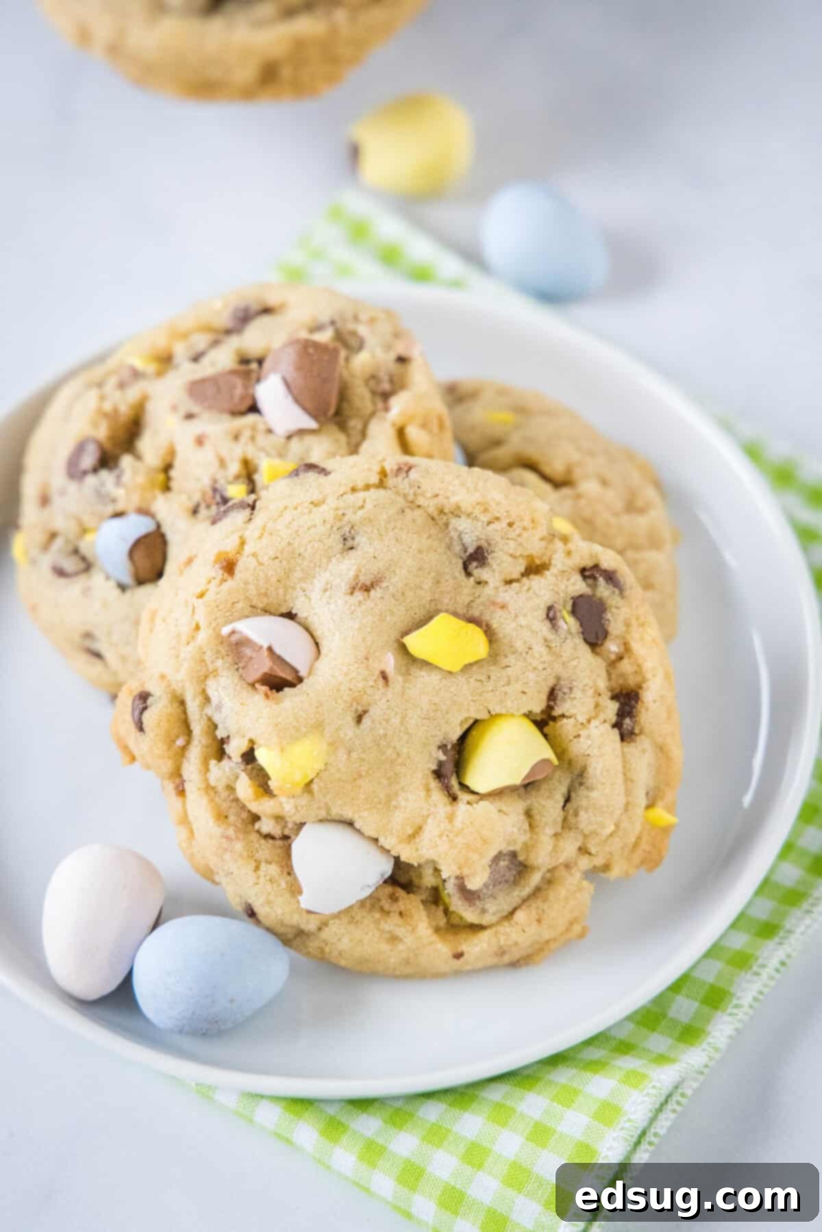 Ultimate Cadbury Mini Egg Cookies 6 looking down on a plate with cadbury mini egg cookies, vibrant and delicious
