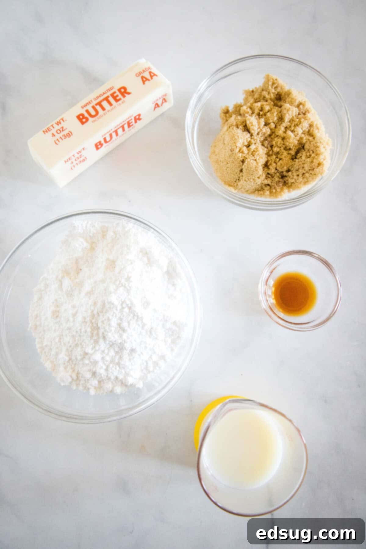 These cookie dough cookies are bakery-style sugar cookies topped with creamy cookie dough frosting, edible cookie dough, and chocolate chips! Fresh ingredients for the creamy brown sugar frosting, including powdered sugar, brown sugar, butter, milk, and vanilla extract.