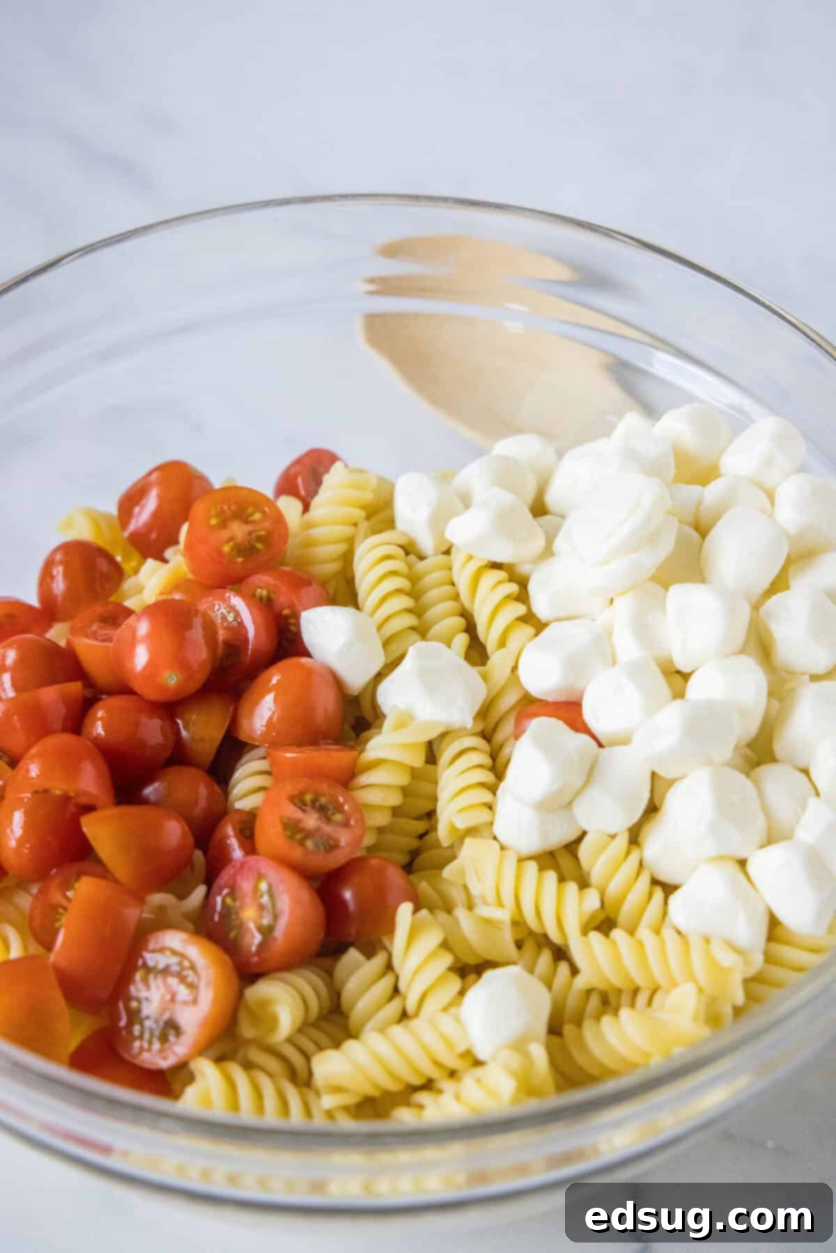 ingredients being prepped for pesto pasta salad