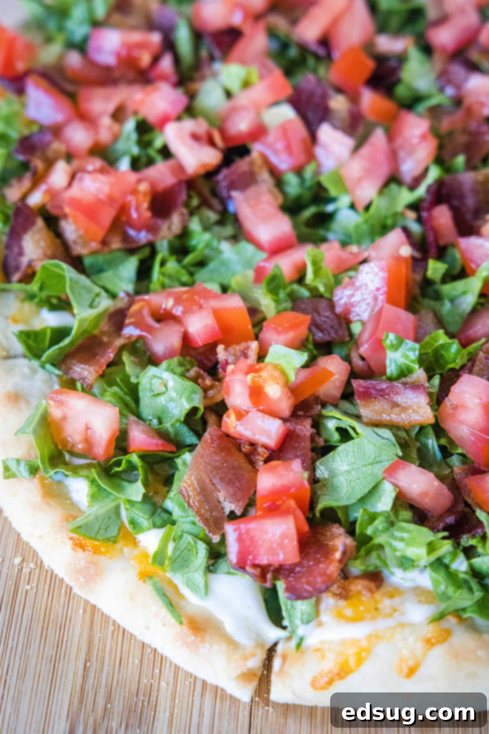 Close up of a BLT pizza.