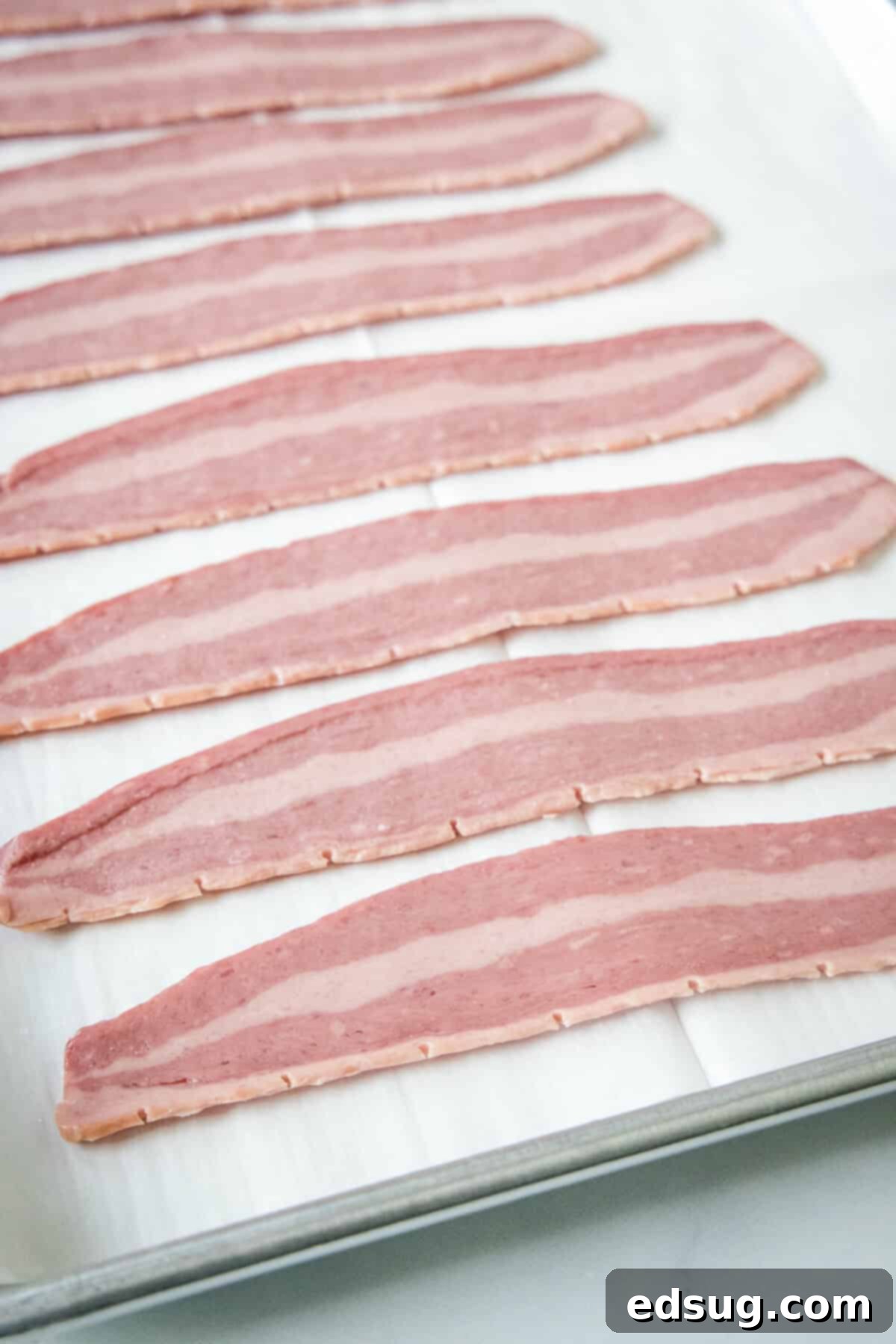 arranging turkey bacon on sheet pan