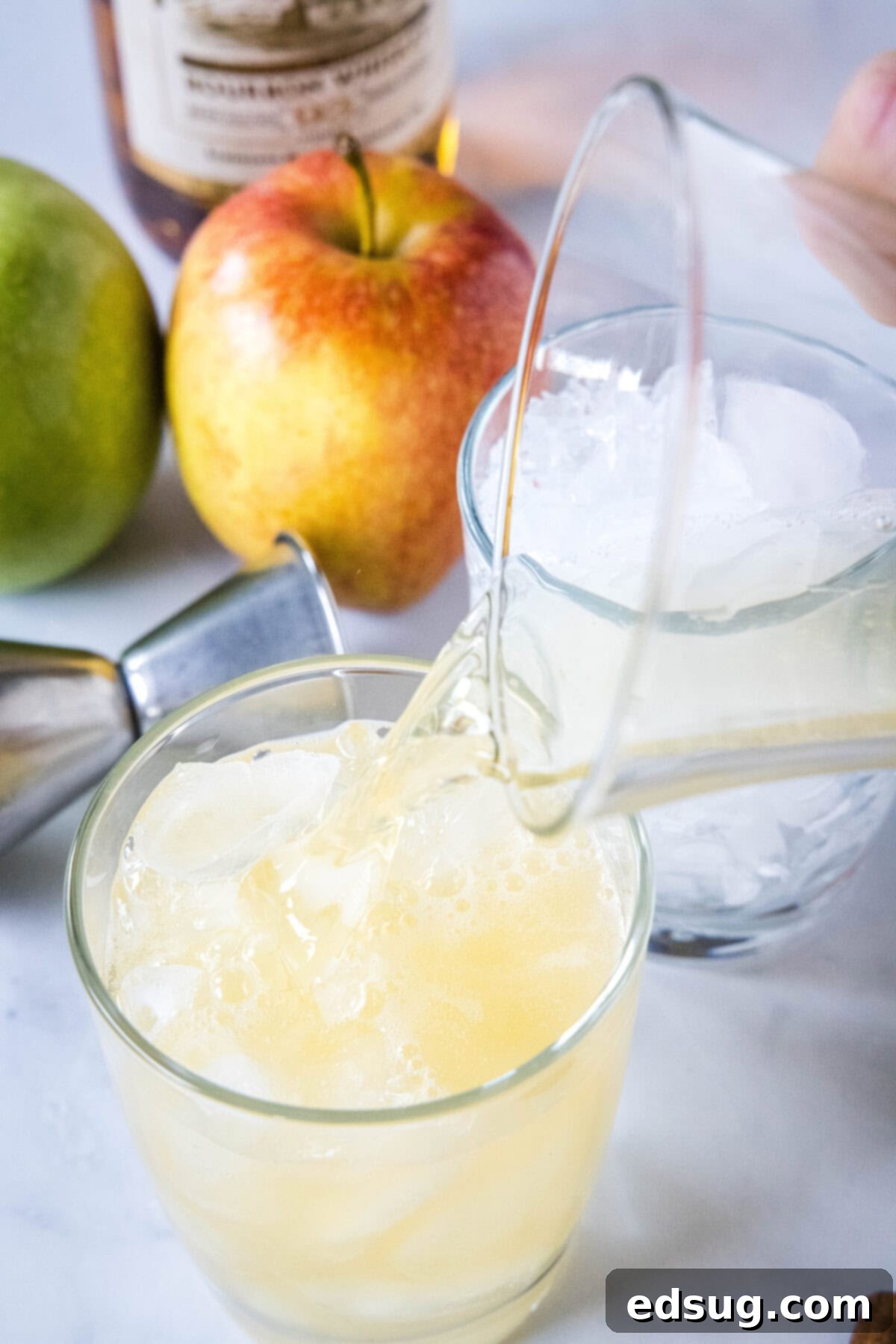 pouring a drink into a glass