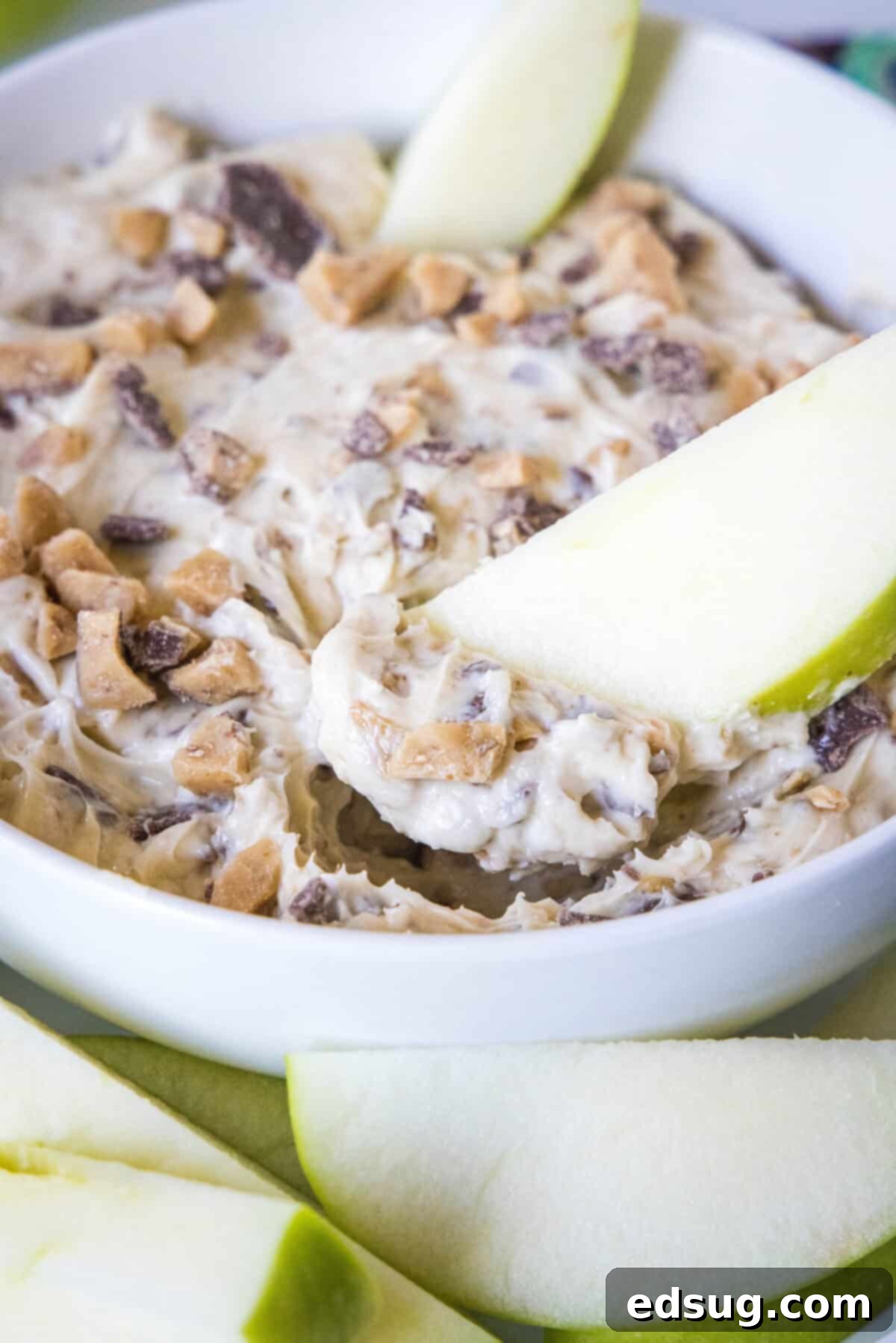Toffee Apple Indulgence 6 apple scooping up toffee apple dip from a bowl