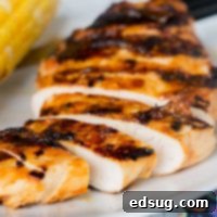 Grilled Chicken with Peach Barbecue Sauce - juicy grilled chicken with a sweet, smoky, and slightly spicy peach barbecue sauce.
