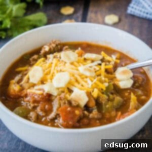 Copycat Wendy's Chili Recipe 9 cropped close up bow of chili with cheese and crackers