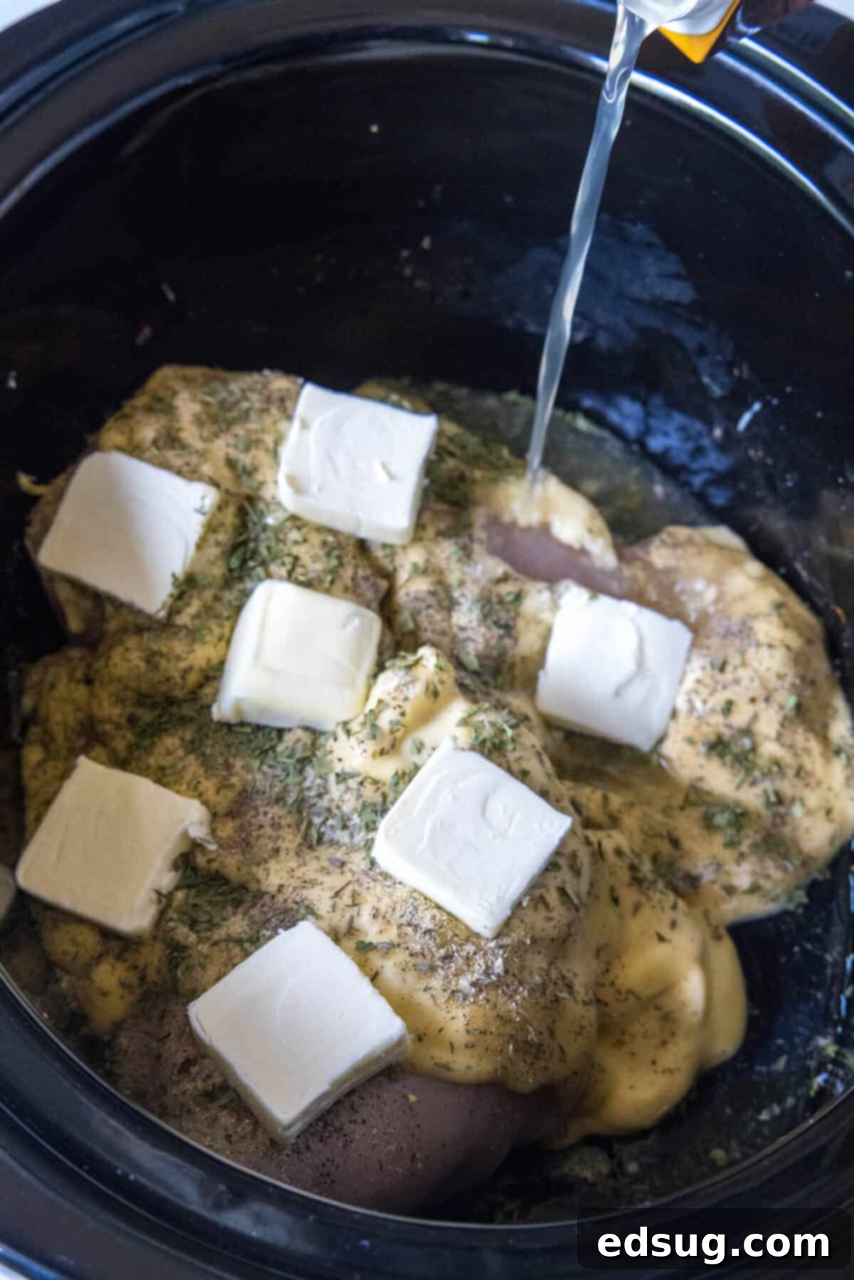 adding broth to crockpot