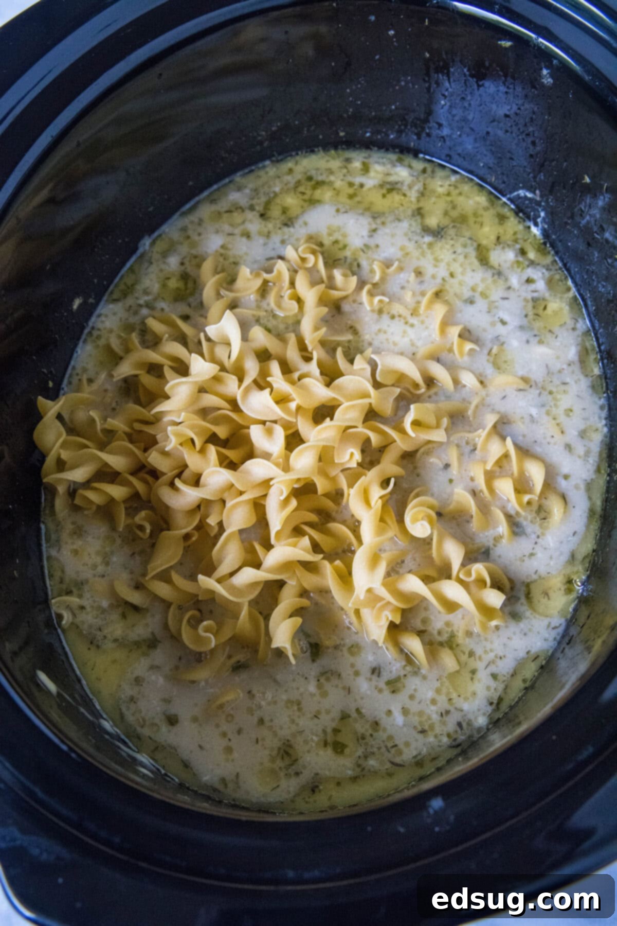 adding noodles to crockpot