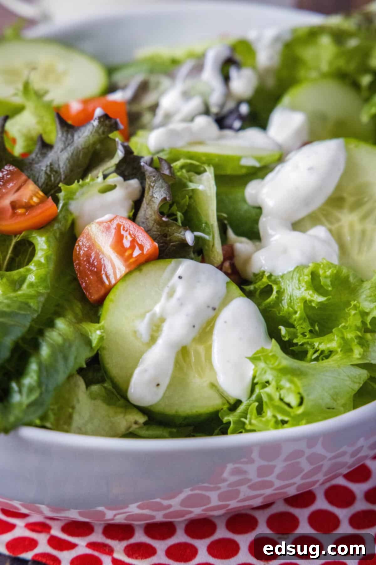 Velvety Garlic Dressing 5 garlic dressing poured over a salad
