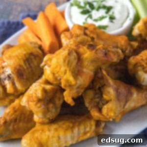 cropped close up chicken wings on a plate