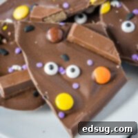 Close up of a piece of Halloween Candy Bark with sprinkles and candy corn