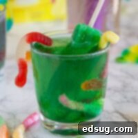 Monster Juice, a kid-friendly green drink with popsicle garnishes for Halloween