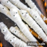 Close up of mummy pretzel rods with candy eyes