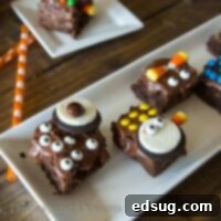 Plate of vibrant green Monster Brownies with candy eyes