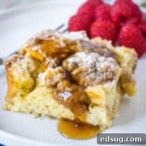 Sleep-In French Toast Casserole 9 cropped close up overnight French toast casserole topped with syrup