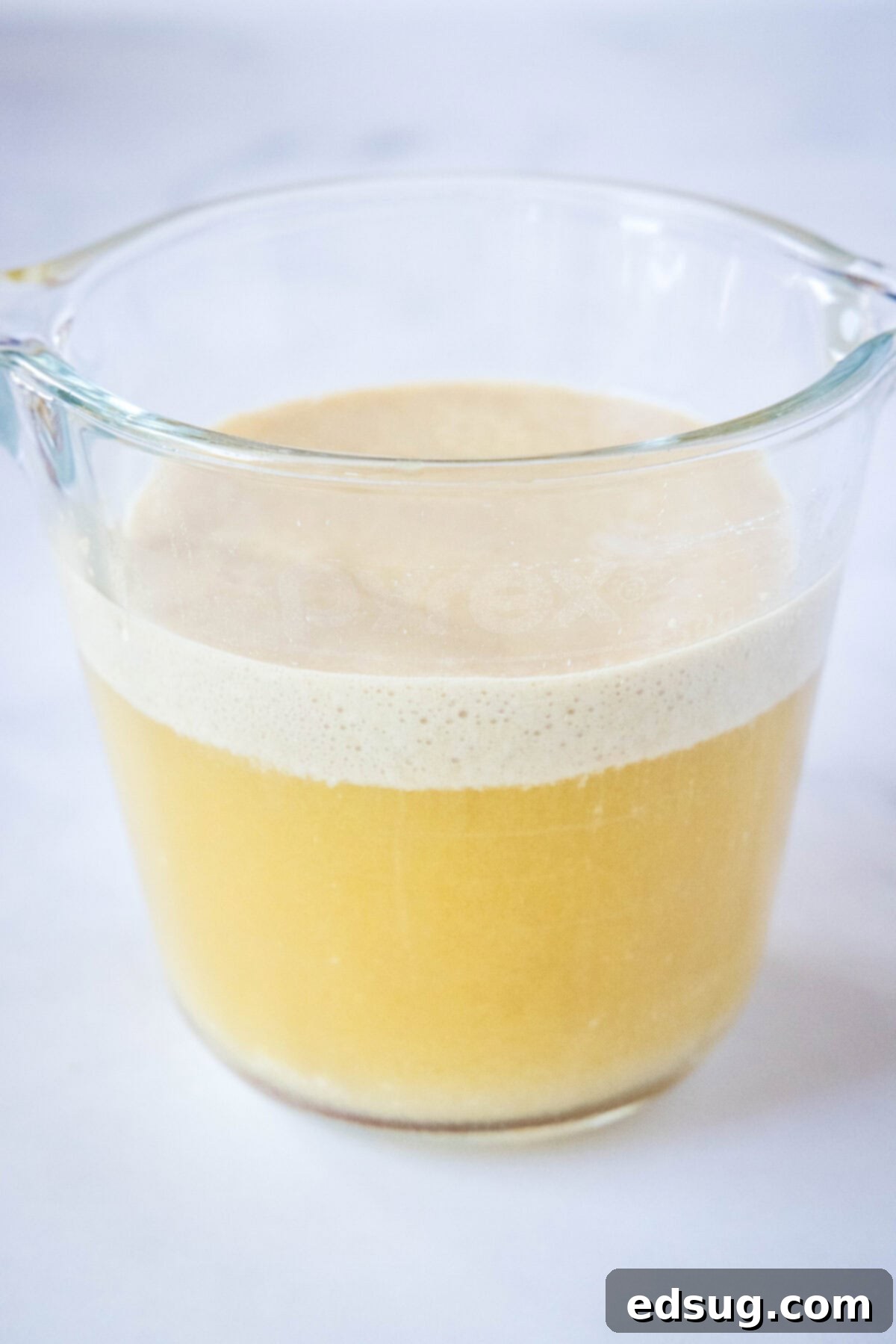 blooming yeast in measuring cup