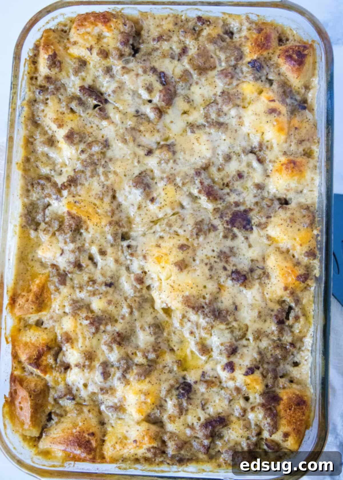 Southern Style Biscuits and Gravy Bake 5 looking down on casserole of baked biscuits and gravy casserole
