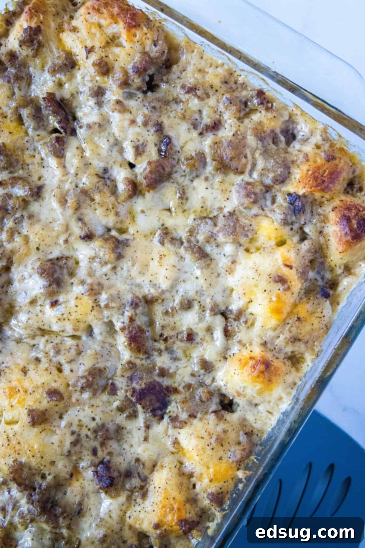Southern Style Biscuits and Gravy Bake 7 looking down on casserole dish of biscuits and gravy casserole