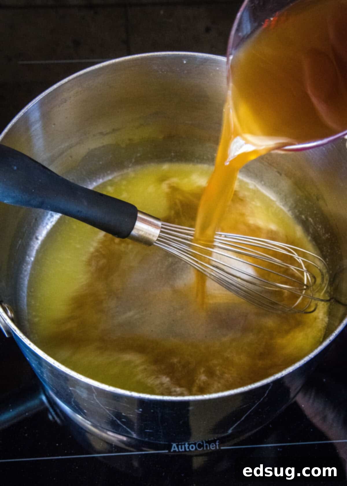 Hearty Pan Gravy 4 pouring broth into a sauce pan