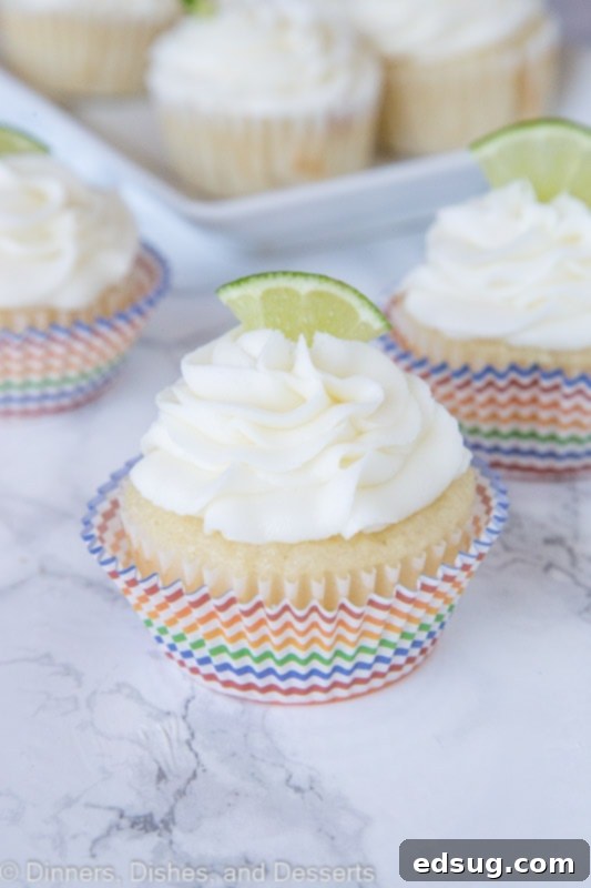 Zesty Margarita Cupcakes 2 margarita cupcakes topped with frosting and a lime slice