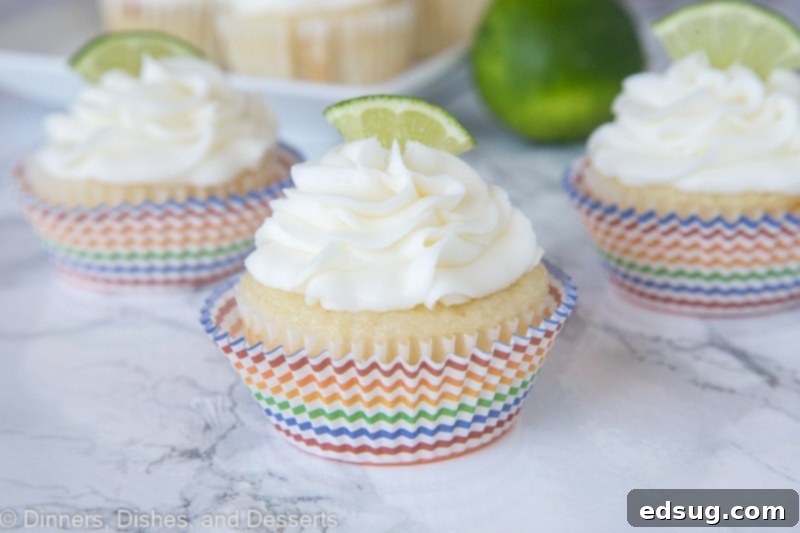 Zesty Margarita Cupcakes 3 margarita cupcakes topped with frosting and a lime slice