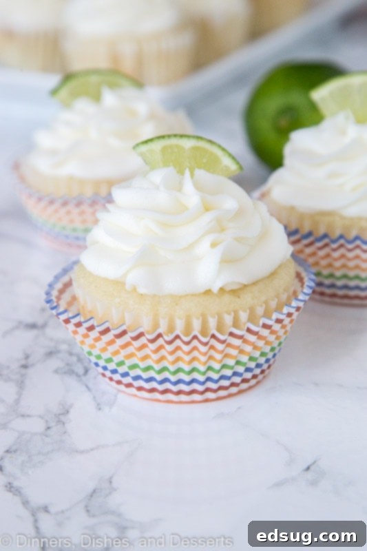 Zesty Margarita Cupcakes 4 close up of margarita cupcakes topped with frosting and a lime slice
