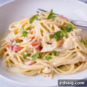 Effortless Slow Cooker Chicken Spaghetti 9 close up crockpot spaghetti in a plate