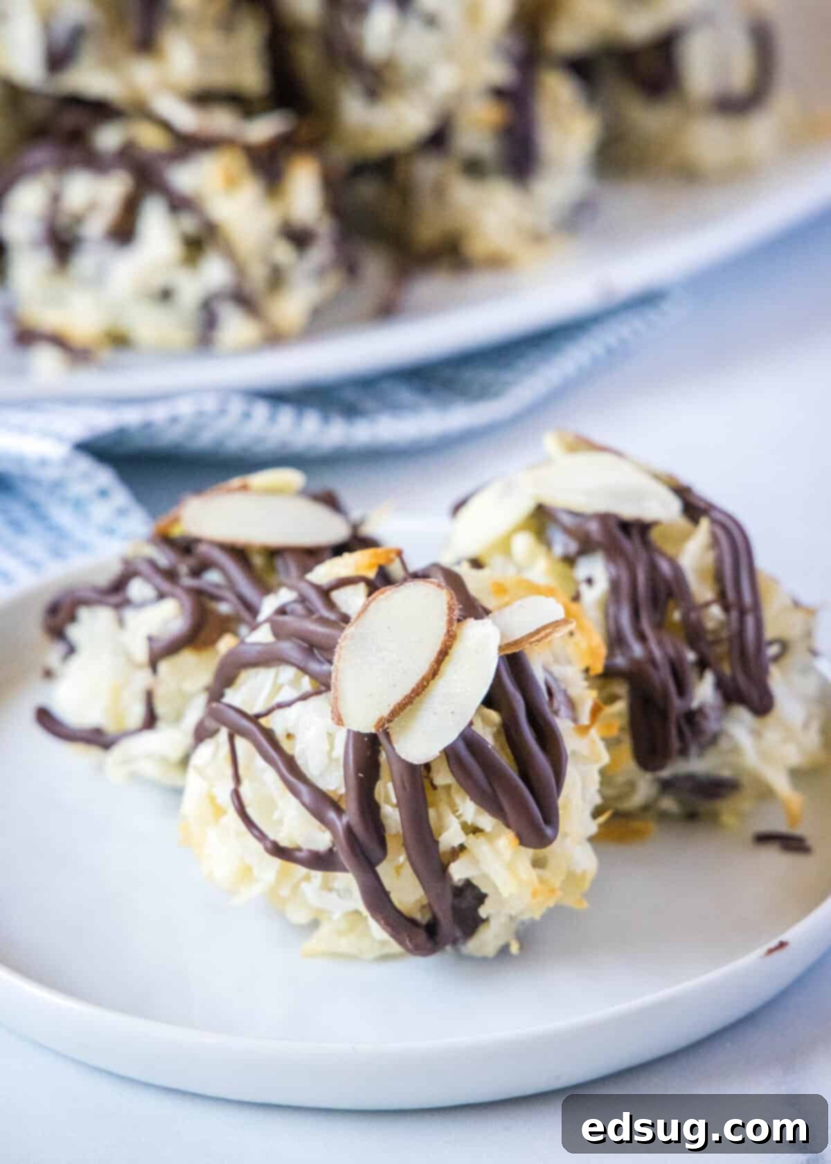 Almond Joyful Coconut Cookies 2 almond joy cookies on a plate