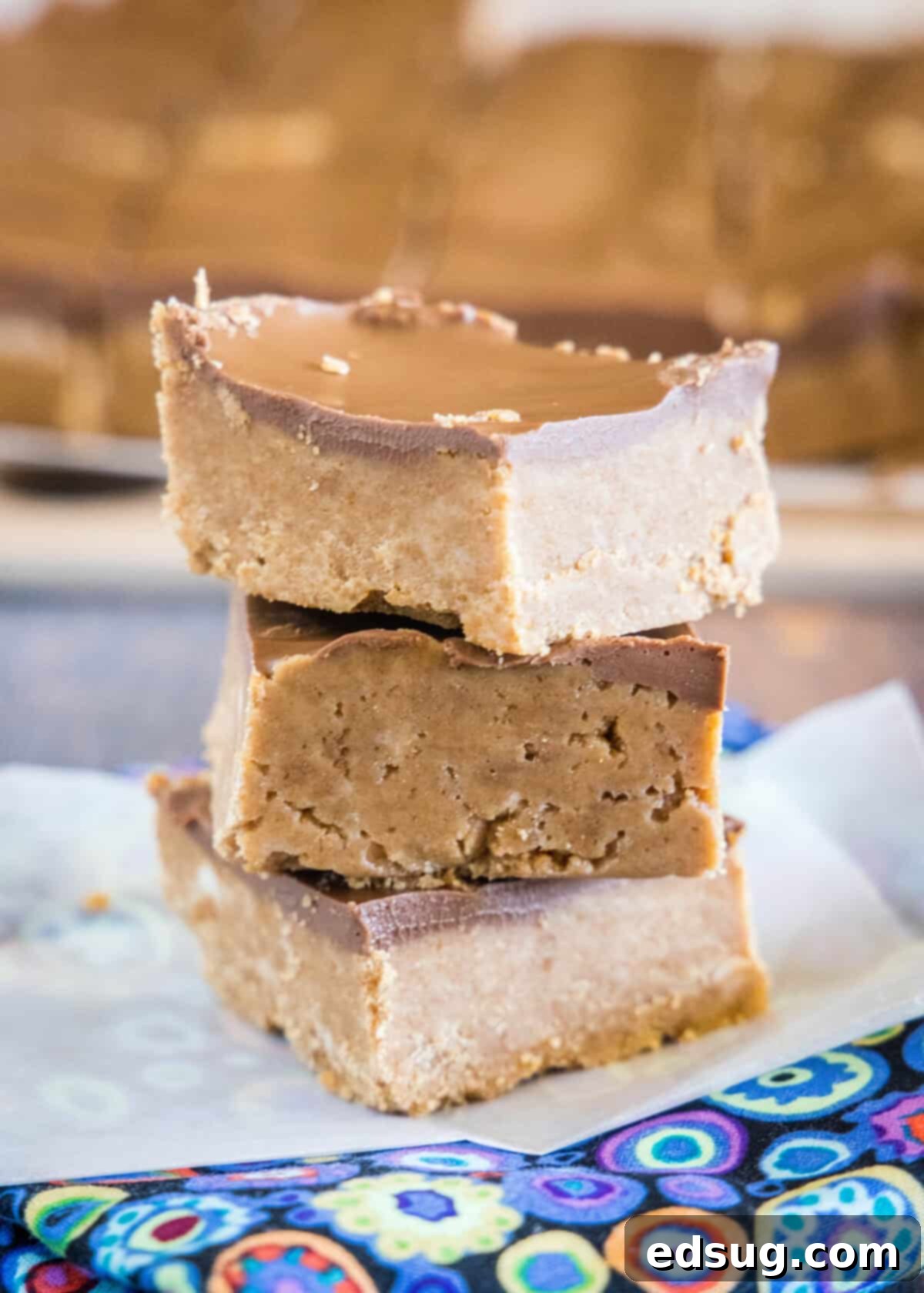 stacked no bake biscoff bars on parchment paper