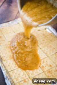 Addictive Chocolate Saltine Christmas Crack 7 pouring sugar mixture over saltine crackers