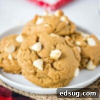 Close up plate of soft and chewy white chocolate gingerbread cookies loaded with white chocolate chips.