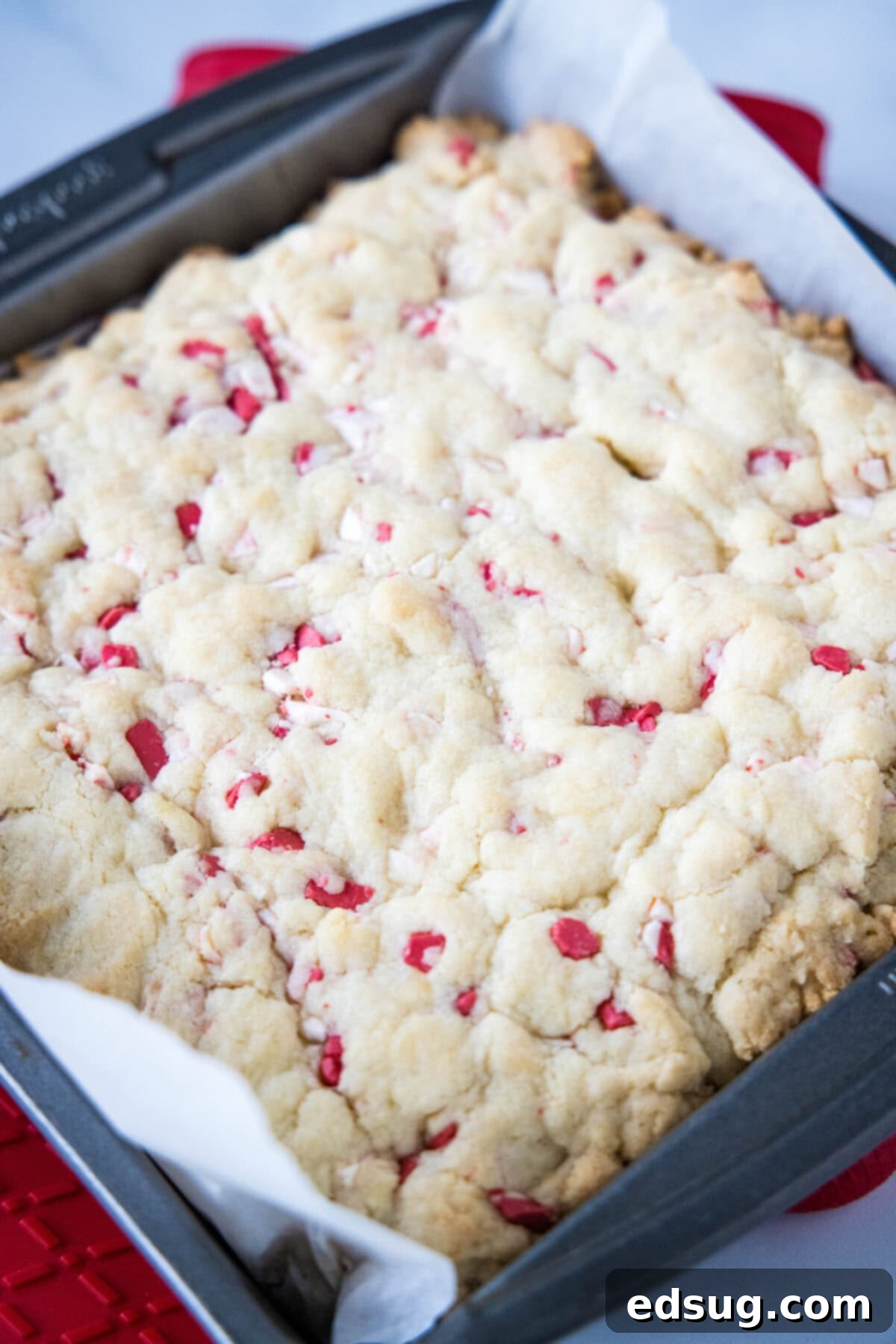 Holiday Peppermint Sugar Cookie Bars 4 baked peppermint sugar cookie bars in pan