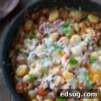 Cheesy Gnocchi Skillet with ingredients laid out around it.
