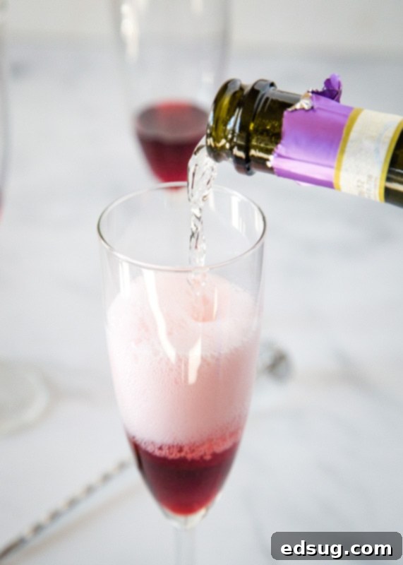 Garnet Pomegranate Sparkler 3 pouring presecco into glass