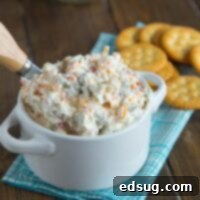 Cheddar Green Olive Dip - A creamy, cheesy, salty green olive, dip that is great warm or cold. 