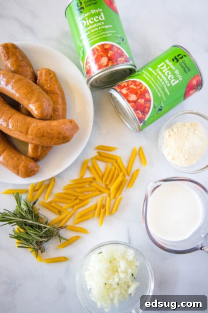 fresh ingredients laid out for creamy sausage pasta