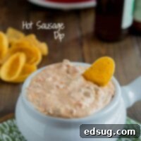 A small bowl of creamy Hot Sausage Dip, ready to be served.