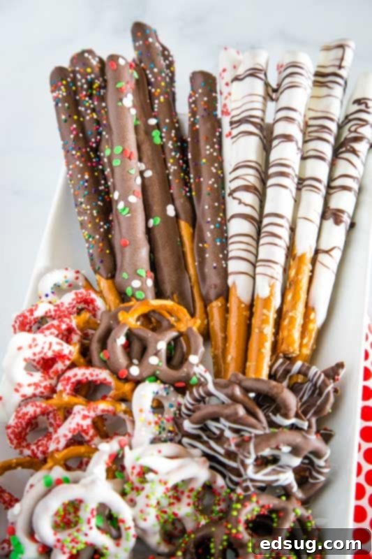 pretzel rods dipped in chocolate on platter