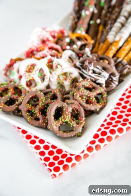 chocolate covered pretzels on white plate`