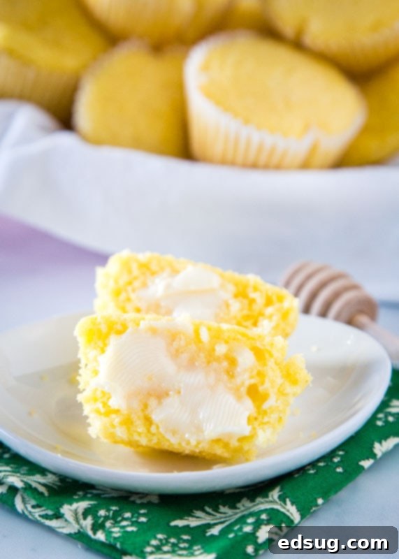 Golden Corn Delights 5 butter spread on corn muffin on a white plate