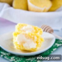 Golden Corn Delights 8 corn muffin with butter on white plate