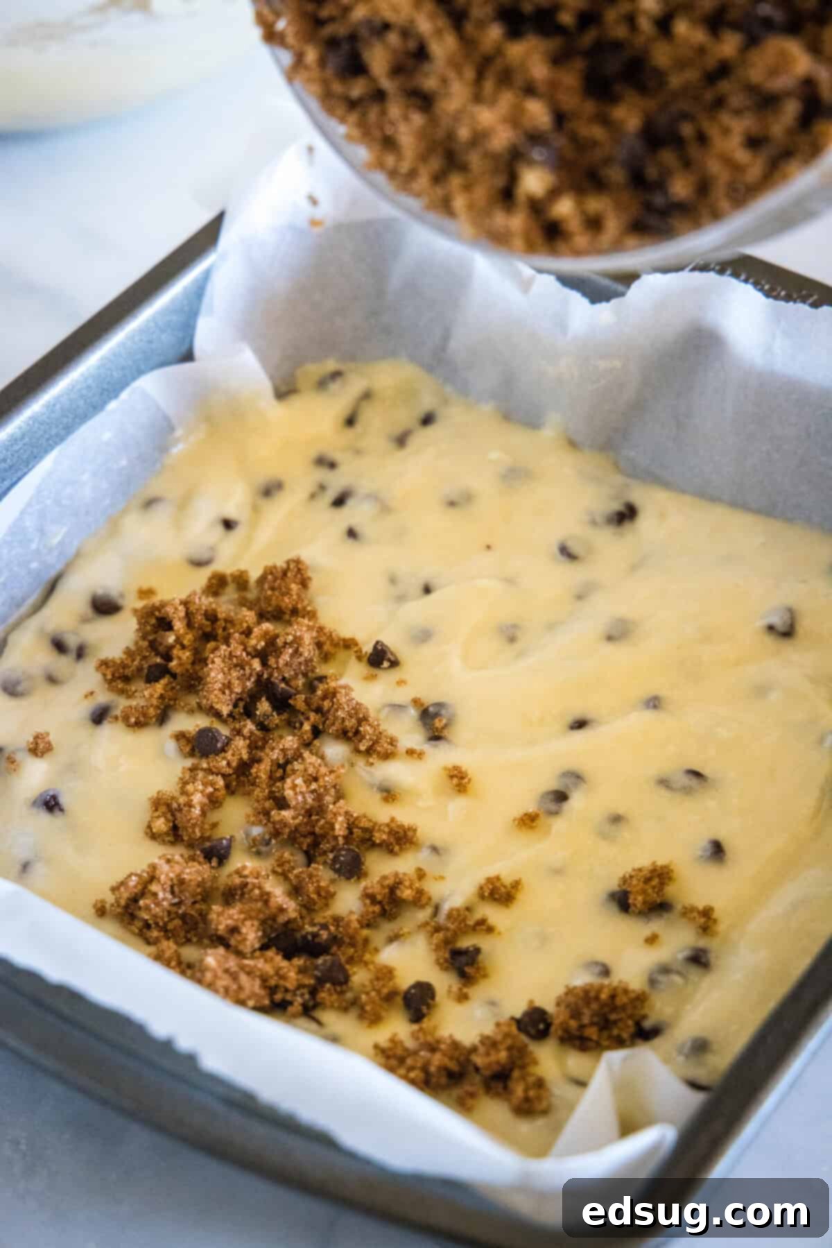 sprinkling streusel on cake batter